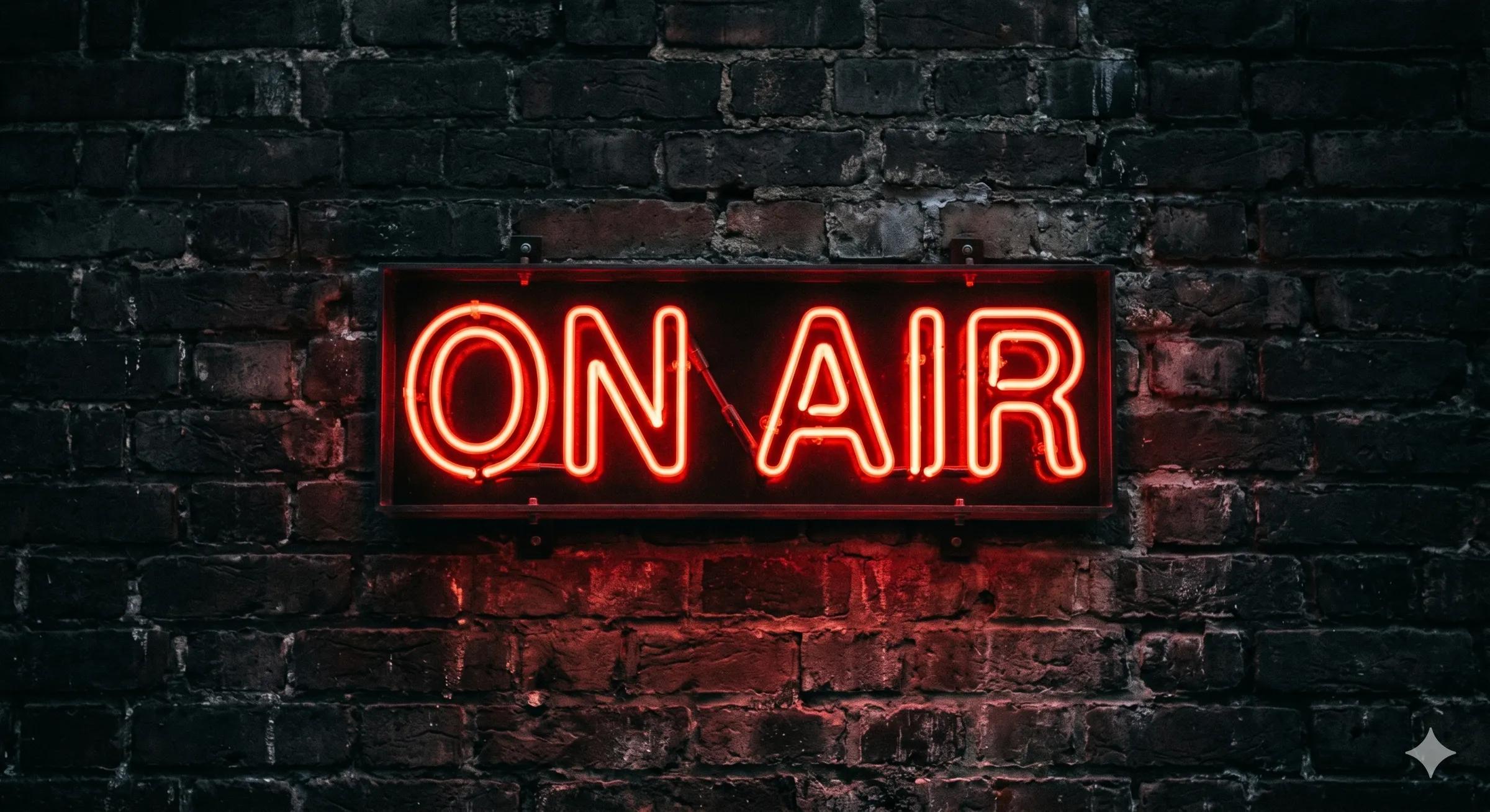 ON AIR neon sign on a brick wall